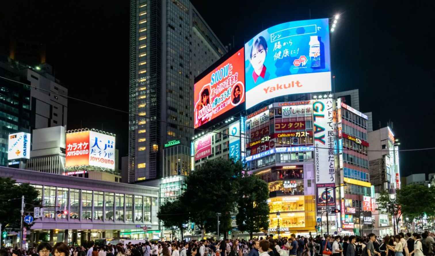 Crowd walking near Shibuya Station in Tokyo.