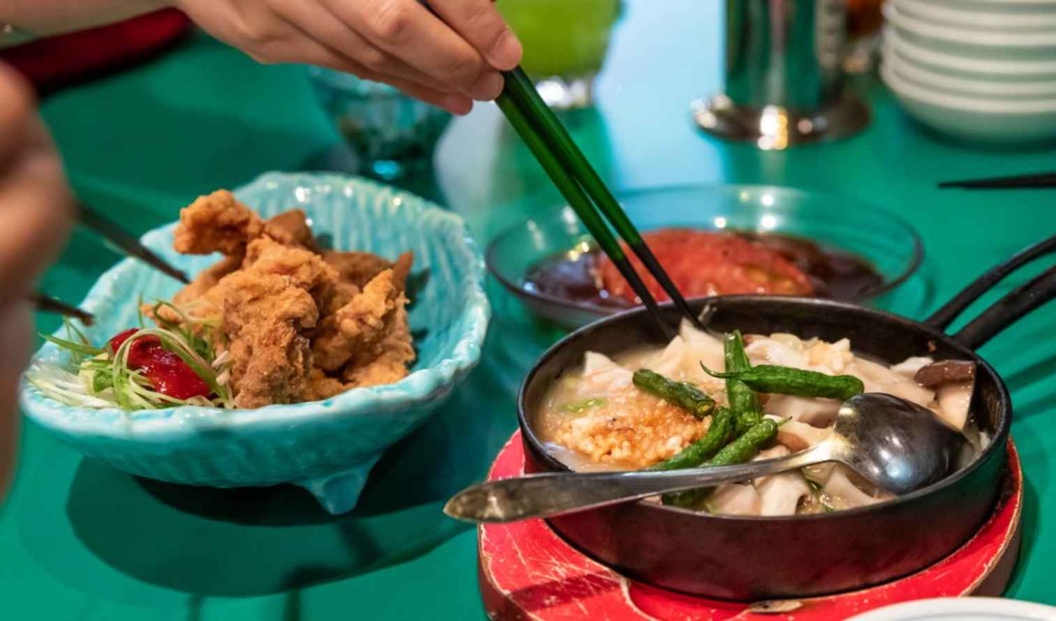 Various dishes including fried chicken and roasted vegetables  in Tokyo.