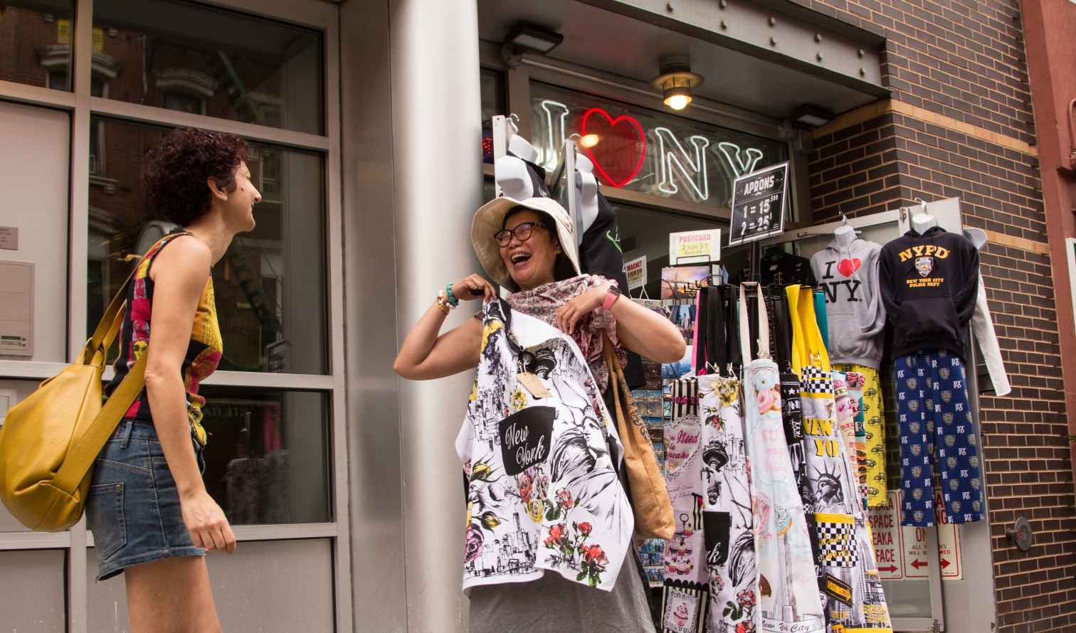 Two women at a souvenir shop in New York City.