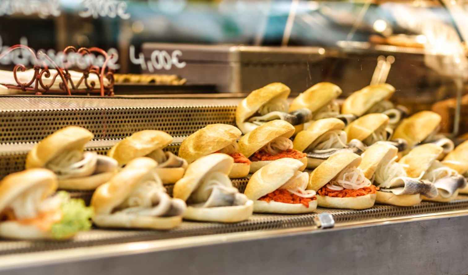 Rows of seafood sandwiches on display in a food market in Munich