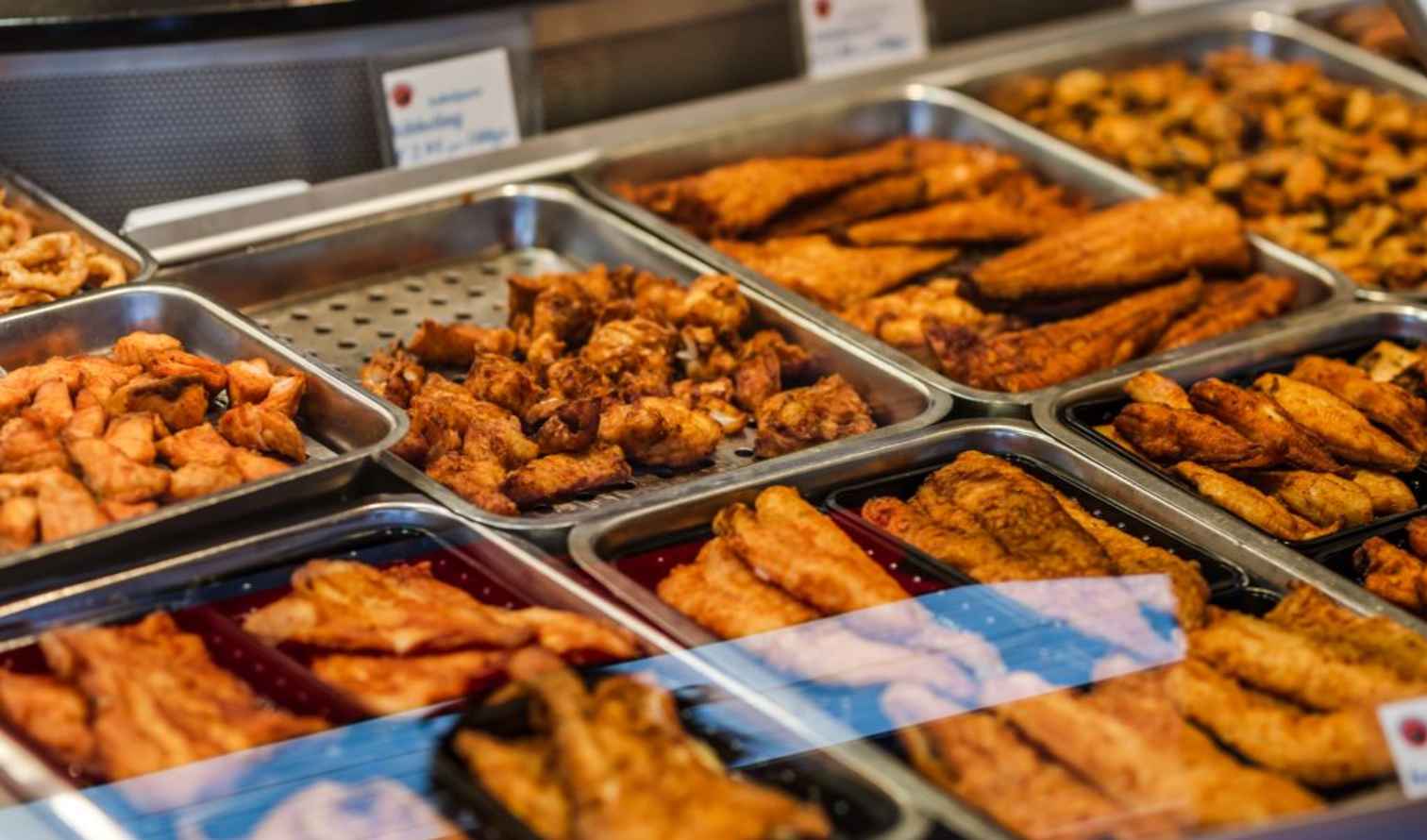 Display of various fried foods in a metal tray in Amsterdam.