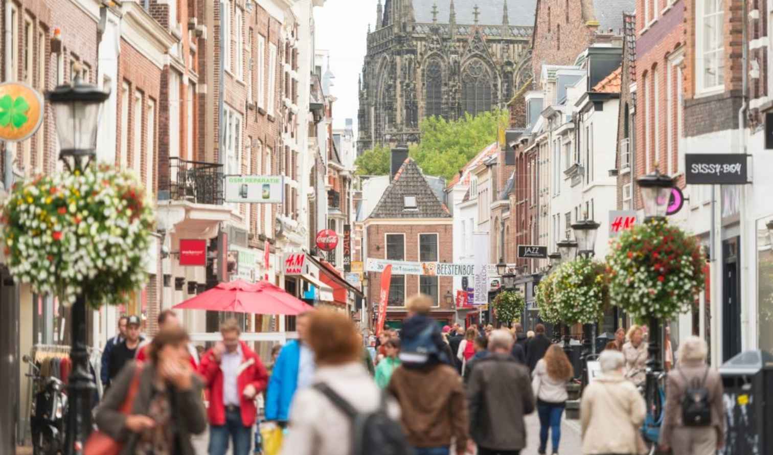 Street view of Utrecht with Dom Tower in the background in Amsterdam.
