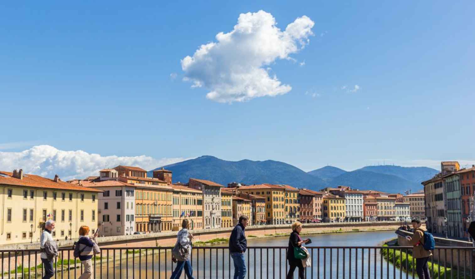 View of buildings along the Arno River in Pisa, Italy.