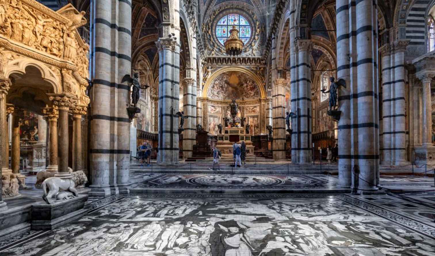 Stained glass window above the altar in Siena Cathedral.