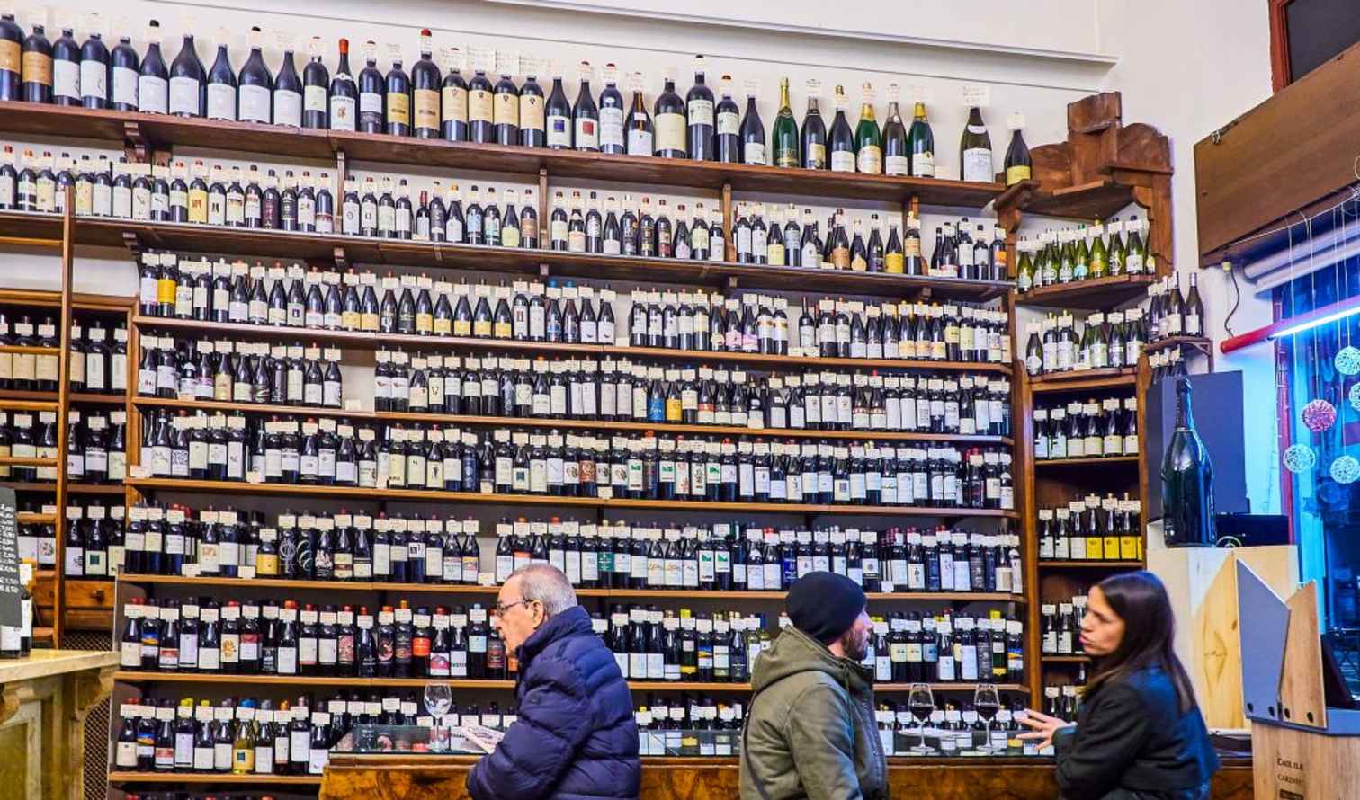 Interior of a wine shop with shelves full of bottles in Palermo