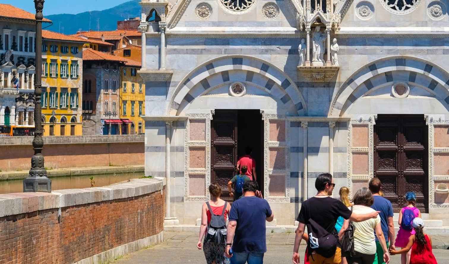 Visitors entering Santa Maria della Spina in Pisa, Italy.