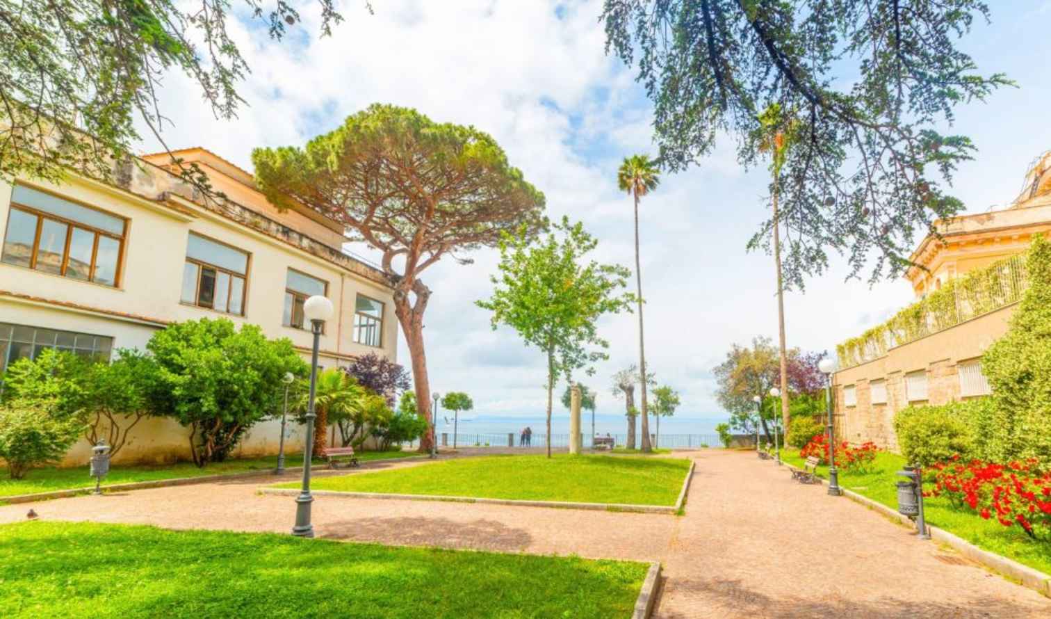 Garden view in Sorrento, Italy, with the sea in the background.