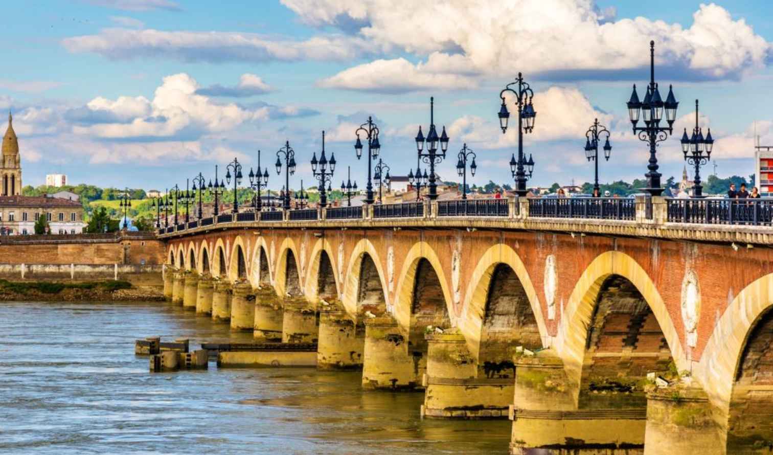 Pont de Pierre bridge spanning the Garonne River in Bordeaux, France.