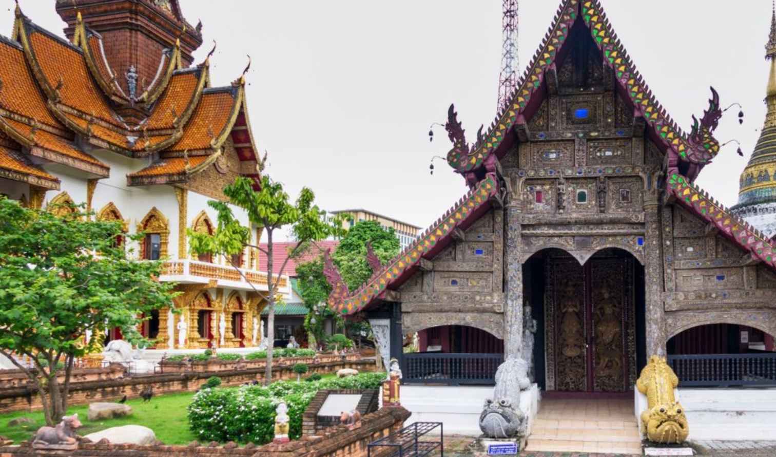 Wat Chiang Man temple entrance with ornate carvings in Chiang Mai, Thailand.