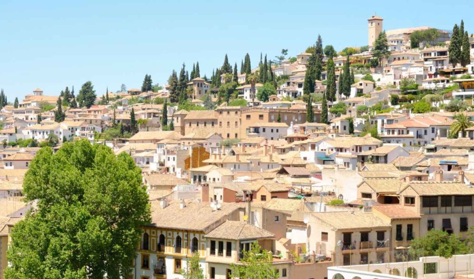 View of Albaicín neighborhood with traditional houses in Granada, Spain.