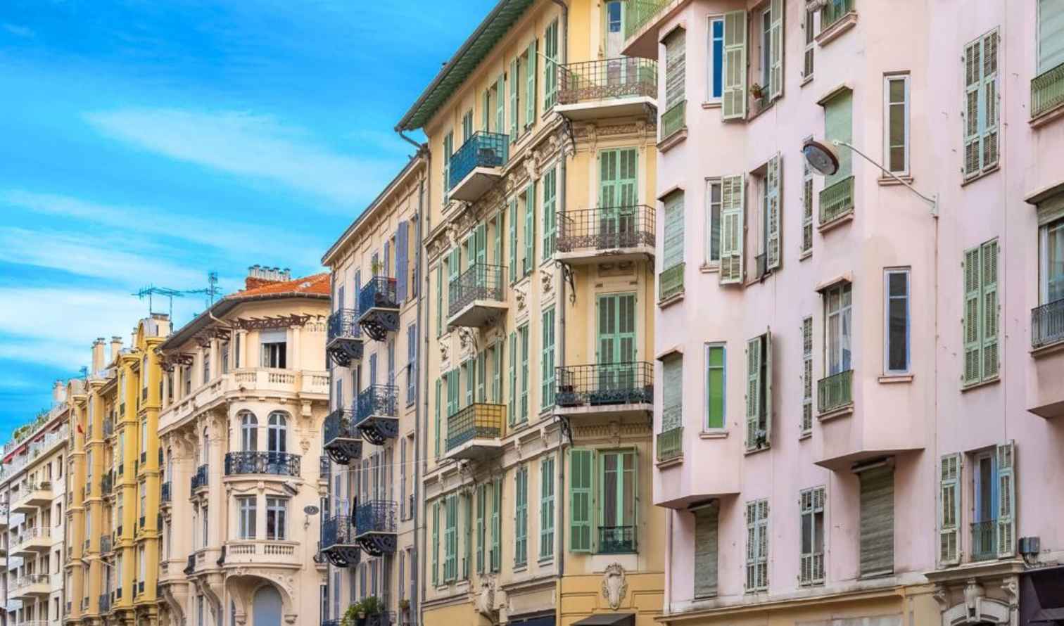 Close-up of historical façades with balconies in Nice, France.