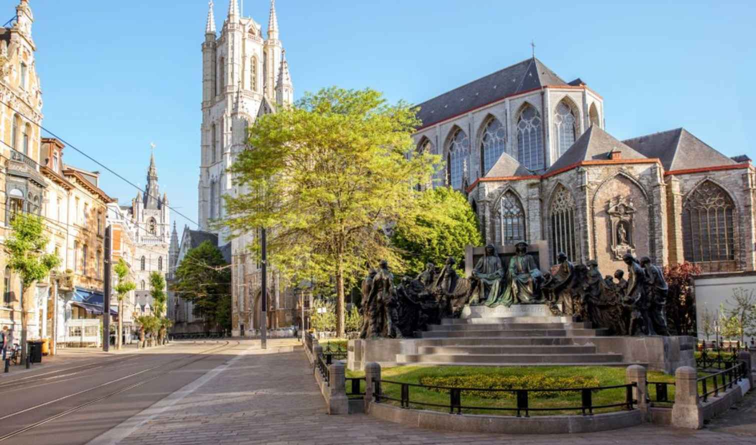 Statue and Saint Nicholas' Church in Ghent, Belgium on a clear day.