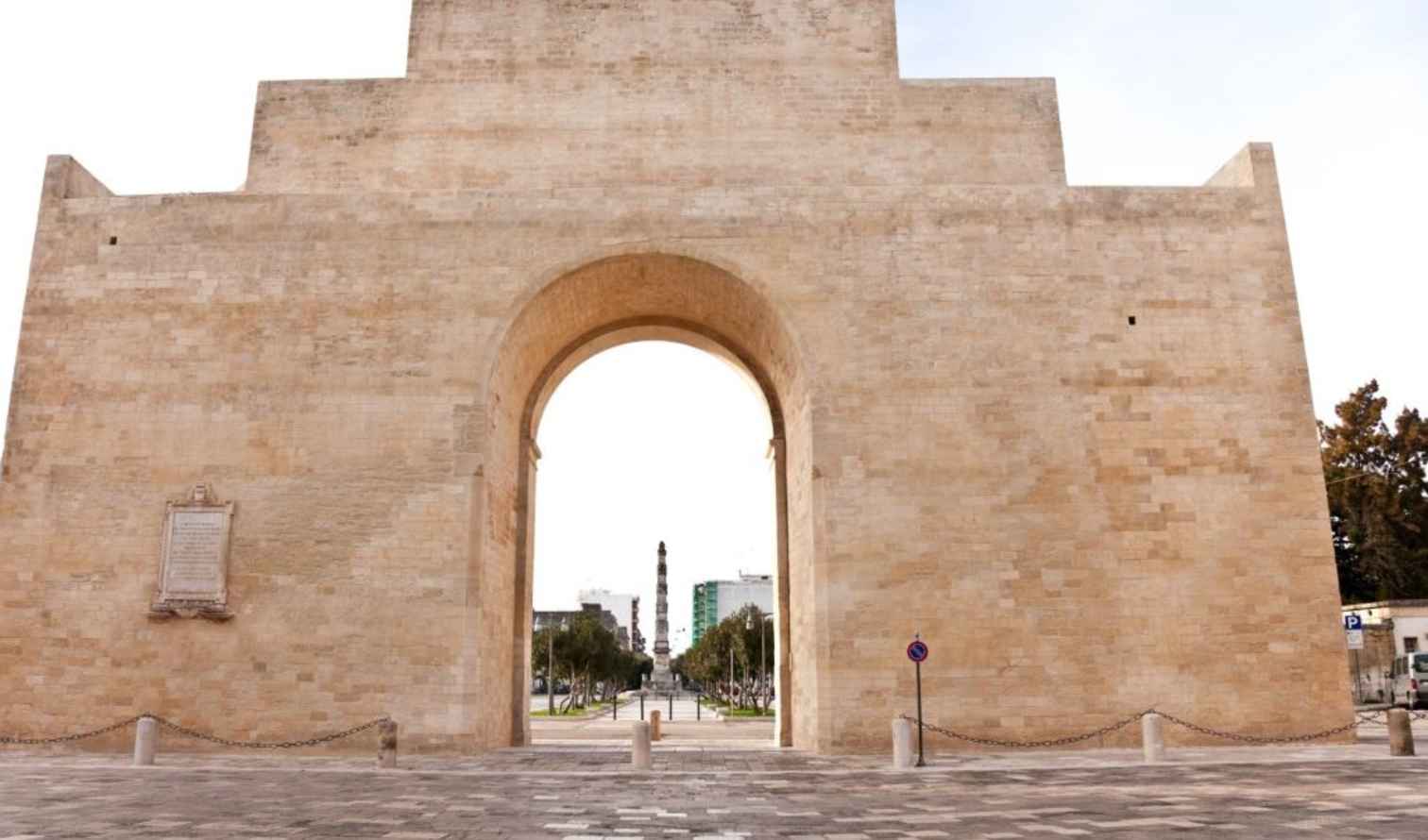 Porta Napoli in Lecce featuring a large central archway in Lecce