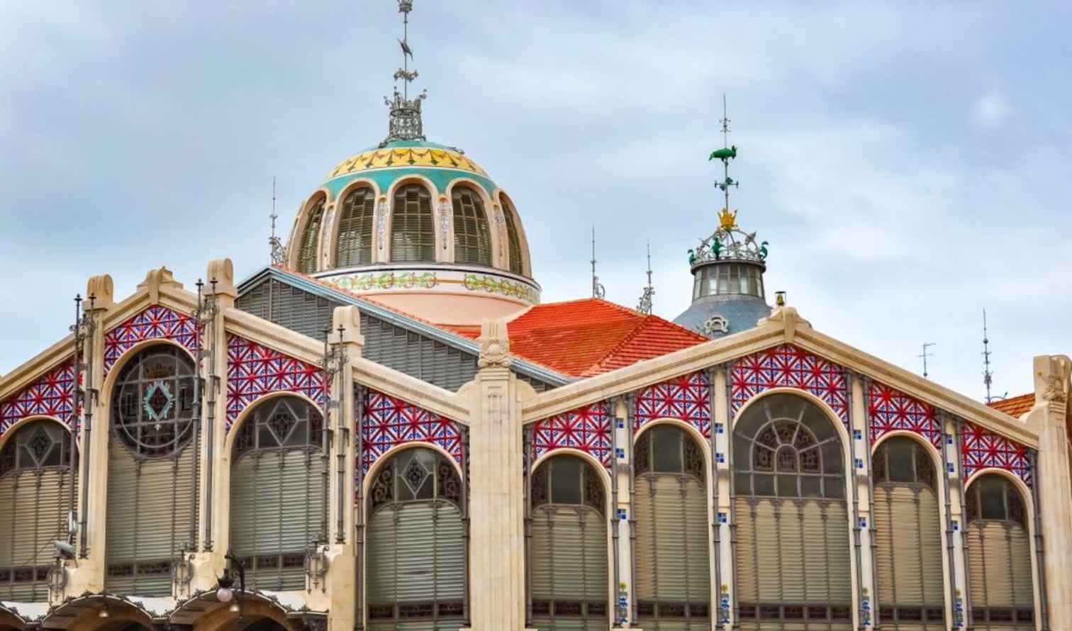Central Market in Valencia, Spain, featuring ornate architecture with colorful details.