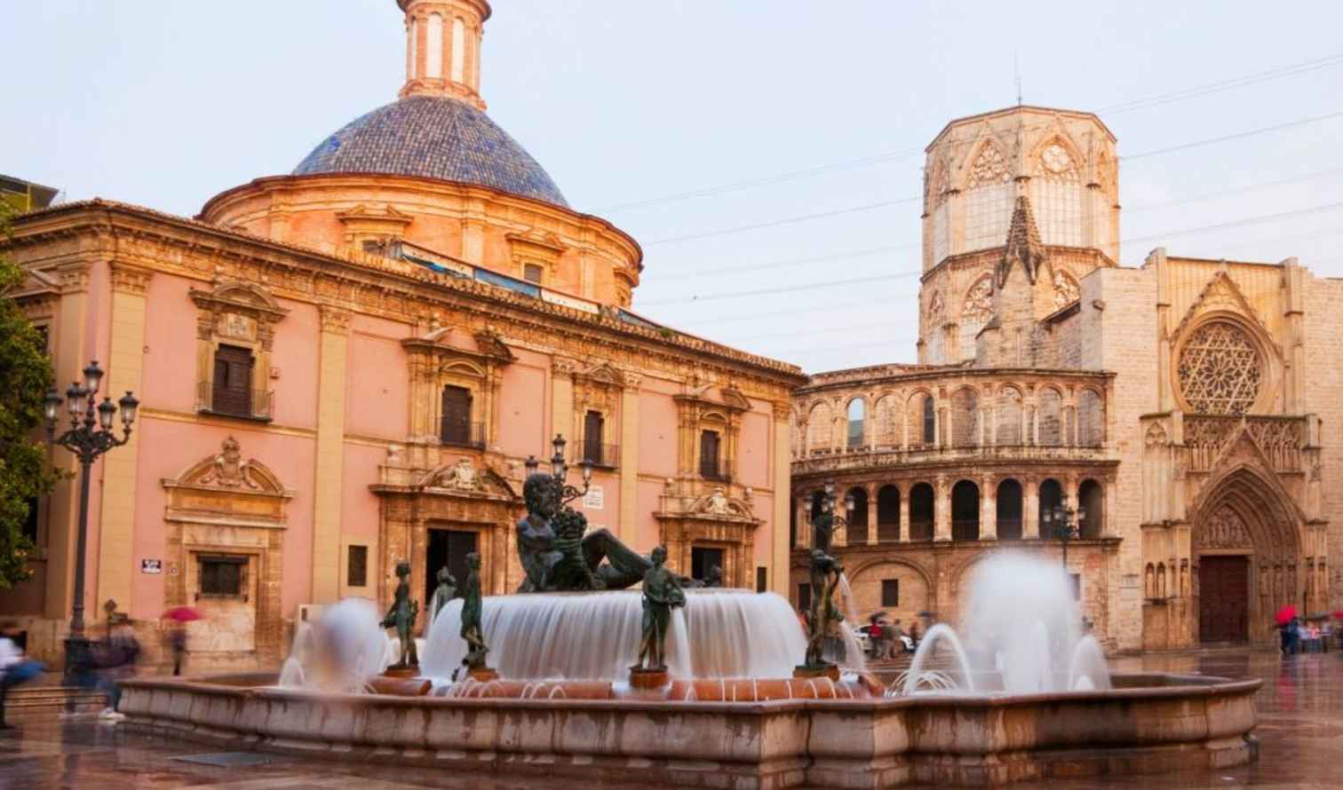 Valencia Cathedral and plaza fountain in Valencia, Spain.