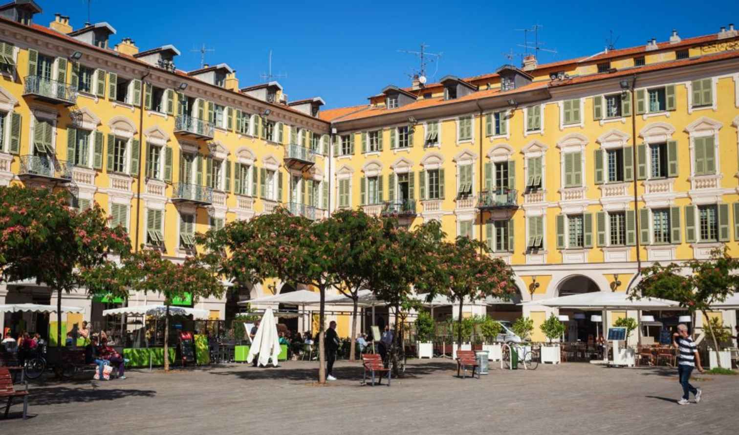 People walking near Place Garibaldi in Nice, France.