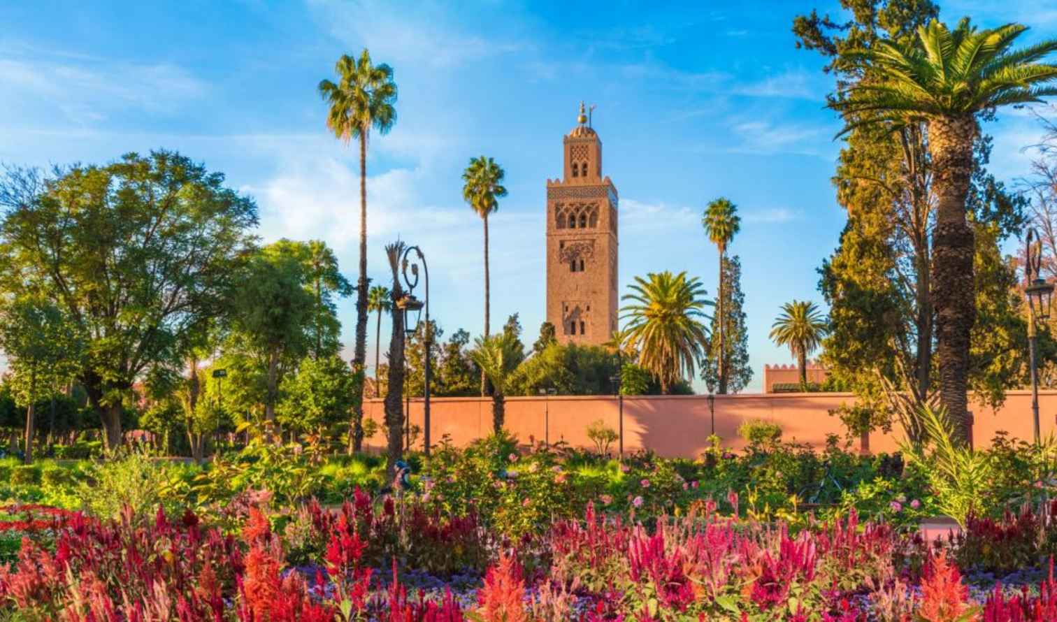 Koutoubia Mosque tower behind a garden in Marrakech, Morocco.