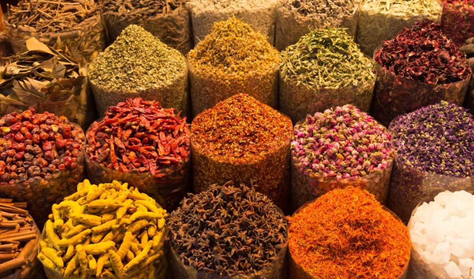 Various spices displayed in sacks at a market stall in Marrakech