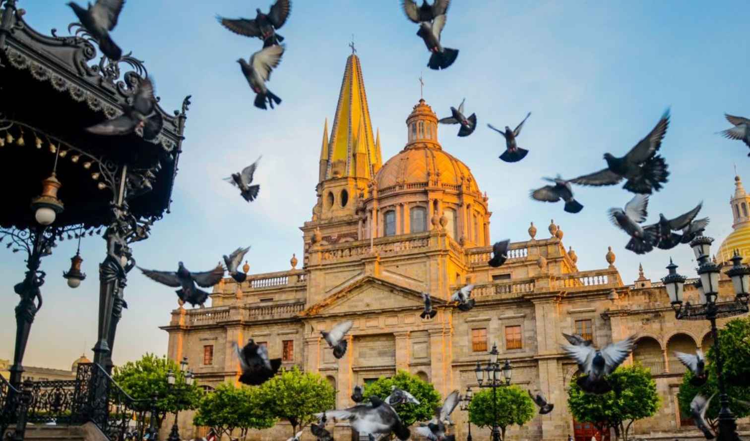 Guadalajara Cathedral with flying pigeons in the foreground.