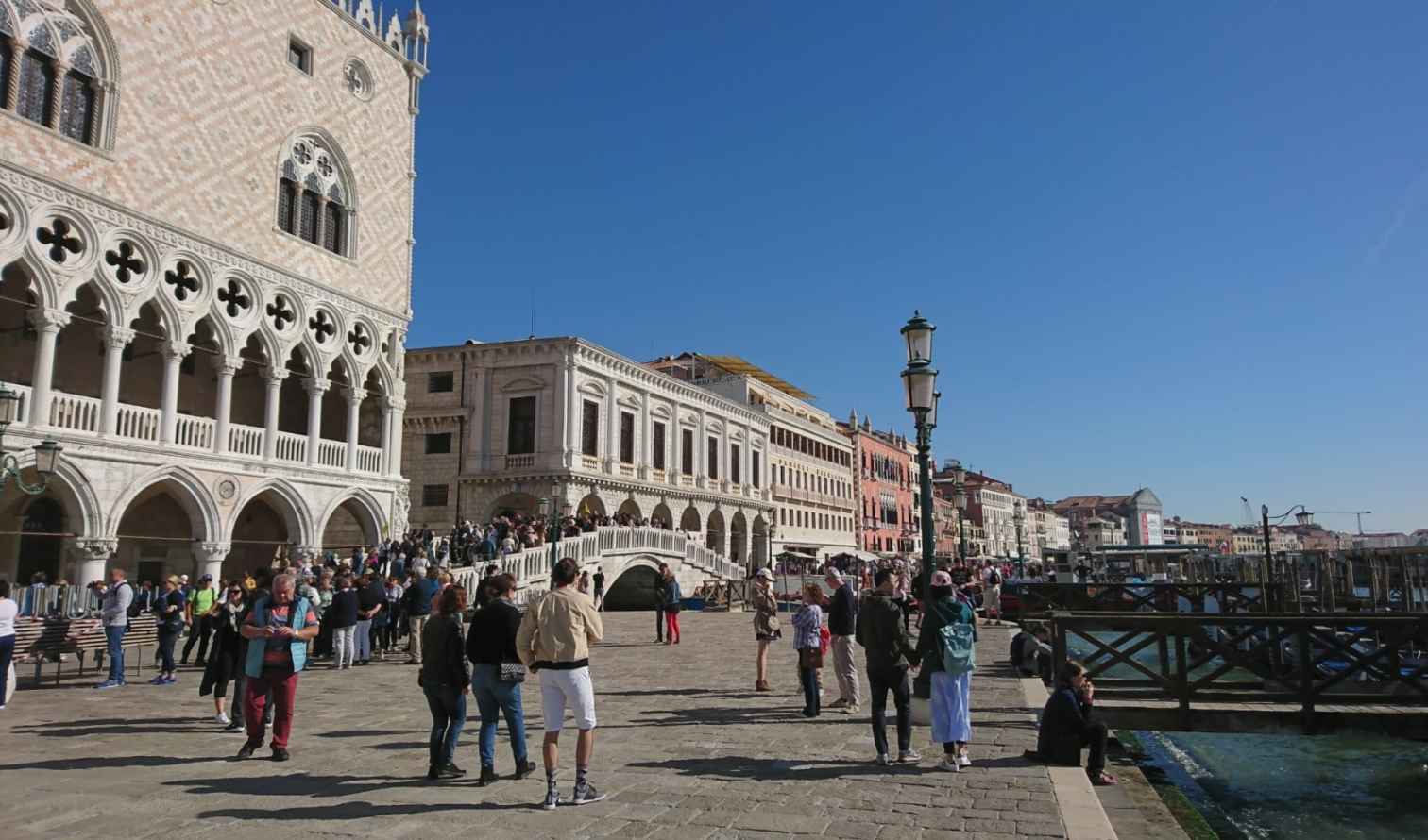 People walking near Doge's Palace in Venice, Italy.
