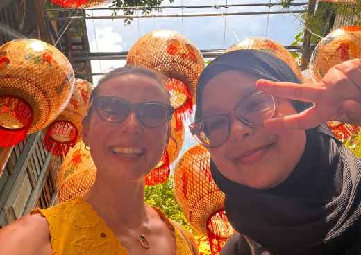 Joyful Smiles Under Vibrant Lanterns