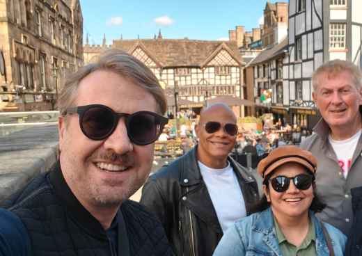 Sunlit Smiles in a Timeless Town Square