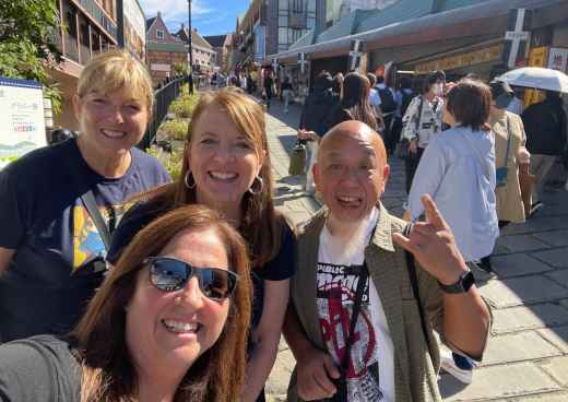 Sunlit Smiles on a Bustling Street