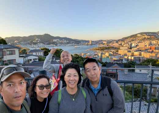 Embracing the View: A Family Moment Above the Bay