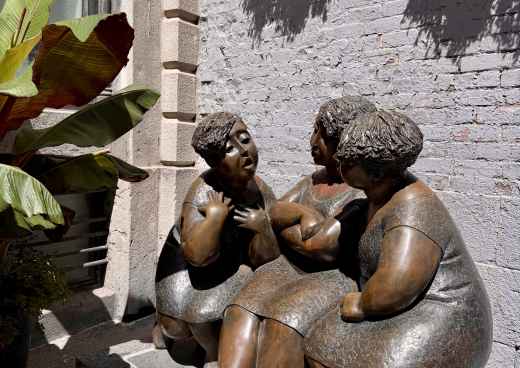 Whispers in Bronze: A Sunlit Conversation