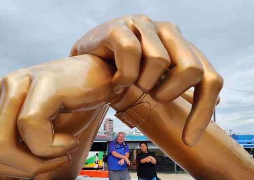 Joyful Encounter Beneath Brilliant Bronze