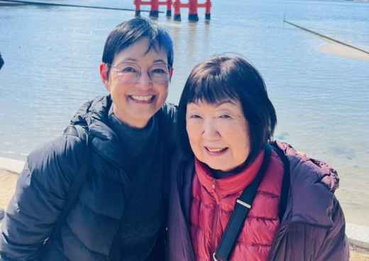 Smiles by the Historic Torii Gate
