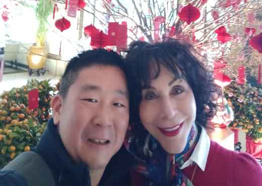 Blossoms and Smiles Amidst a Red Celebration