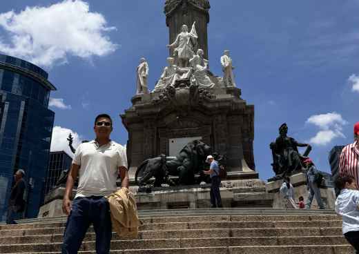 Guardian of Triumph: A Moment Beneath the Angel