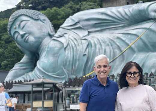Serene Encounter: Guests at the Majestic Reclining Buddha