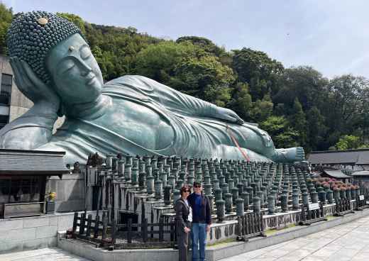 Large bronze sculpture of a reclining Buddha at Nanzo-in Temple, Sasaguri, Japan.