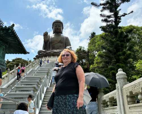 A Moment of Serenity: Standing with the Giant Buddha A Moment of Serenity: Standing with the Giant Buddha