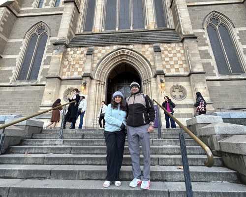 Wanderers' Pause: Captured Before the Cathedral's Grandeur