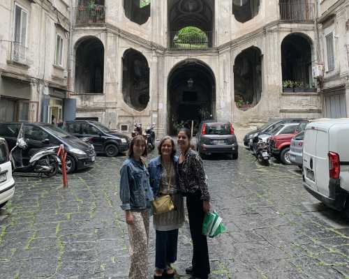 Welcomed by History: Smiles in a Vintage Courtyard