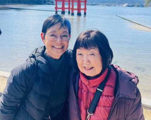 Smiles by the Historic Torii Gate