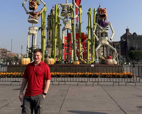 Joyful Visitor Amidst Festive Skeletons