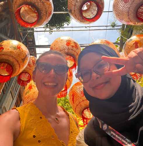 Joyful Smiles Under Vibrant Lanterns