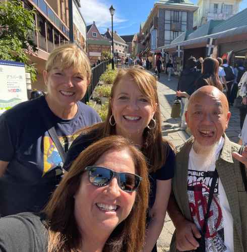 Sunlit Smiles on a Bustling Street