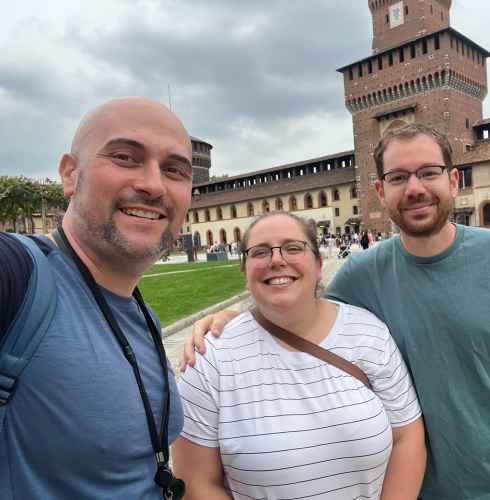 Joyful Trio Exploring Historic Castle Grounds