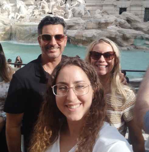 Sunlit Smiles by the Fountain of Wishes