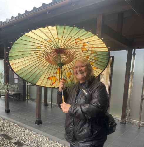 Joyful Stroll Under the Painted Parasol
