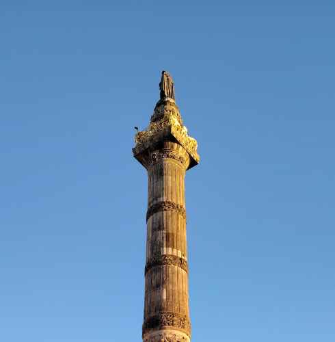 Sunlit Monument: A Golden Evening Encounter