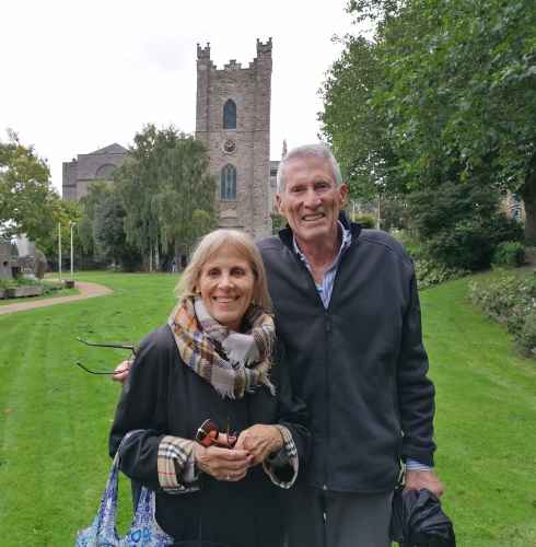 Couple standing in front of St. Audoen's Church, Dublin.
