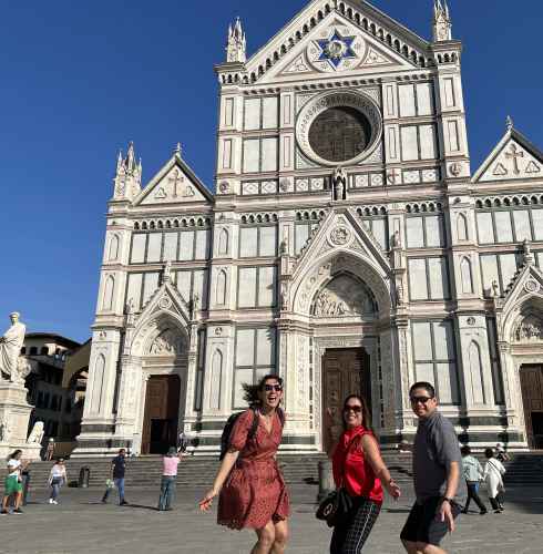 Visitors standing outside Basilica di Santa Croce, Italy.