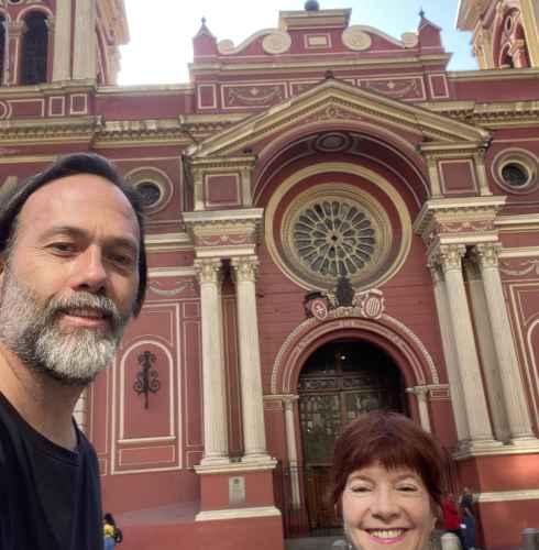 Two people in front of Basilica de la Merced in Santiago.