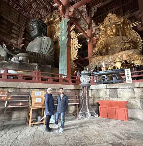 Taking in the grandeur of ancient statues in Nara's temple.